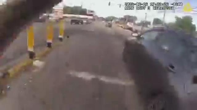 COP SHOOTS CAR AFTER CONFRONTING CONFUSED DRIVER  Footage of a shooting 2 days ago in which an officer drew her gun and shot in the direction of a driver who sped away.   The video is going viral for being an alleged example of a "totally unstable" officer endangering the public.