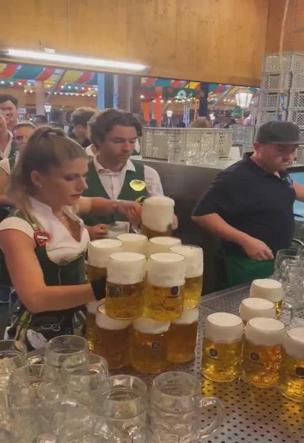 Wow! 🍺  I know Germany loves their beer but this is incredible how this woman delivers the beer! 🍻