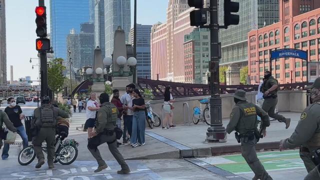 ICE officers pursue a food delivery worker on a bicycle in downtown Chicago, September 2025.