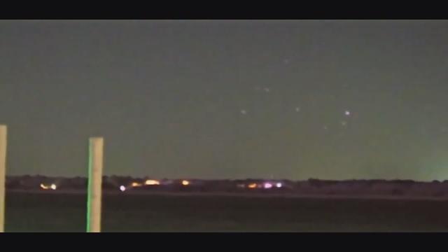Meanwhile over North Carolina   “Wow - there’s several of them right now”  Man films a number of Orbs which seemingly disappear as a Plane shows up.