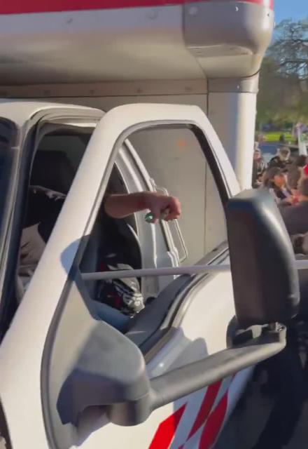Protesters attempt to assault, and possibly kill, the driver of a U-Haul Truck that drove through an Iranian pro-monarchist, anti-regime march today in Los Angeles, only barely being held back by officers with the Los Angeles Police Department.
