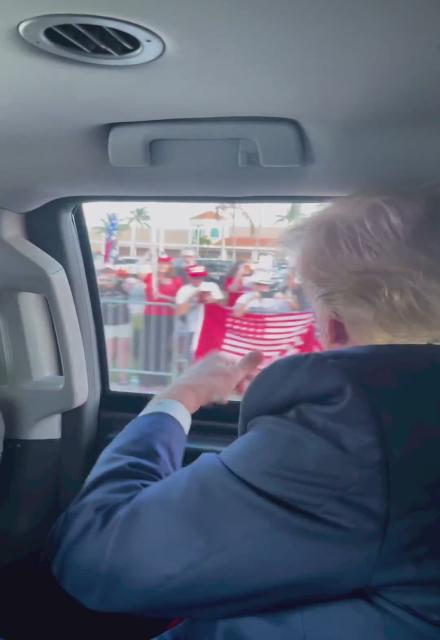 Trump in his Limo waving!